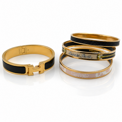 Hermès, Collection of Four Enamel and Gold‑Plated Bangles 