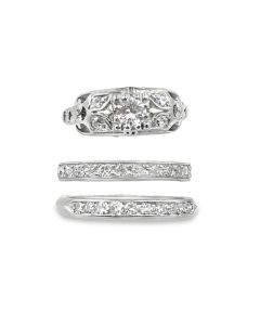 Vintage three‑band wedding suite.