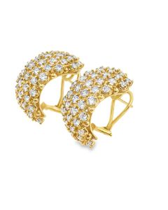 Vintage 18K huggie‑hoop diamond earrings.
